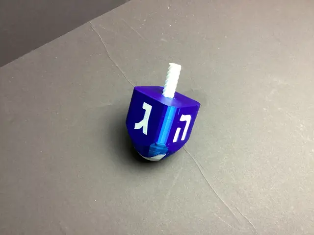 Blue-and-white Wyo Area dreidel; available in two sizes