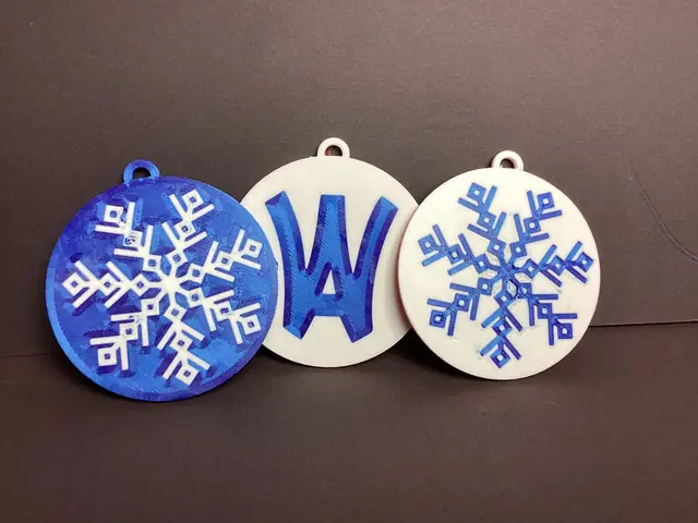 Blue-and-white snowflake and Wyo Area logo flat ornaments